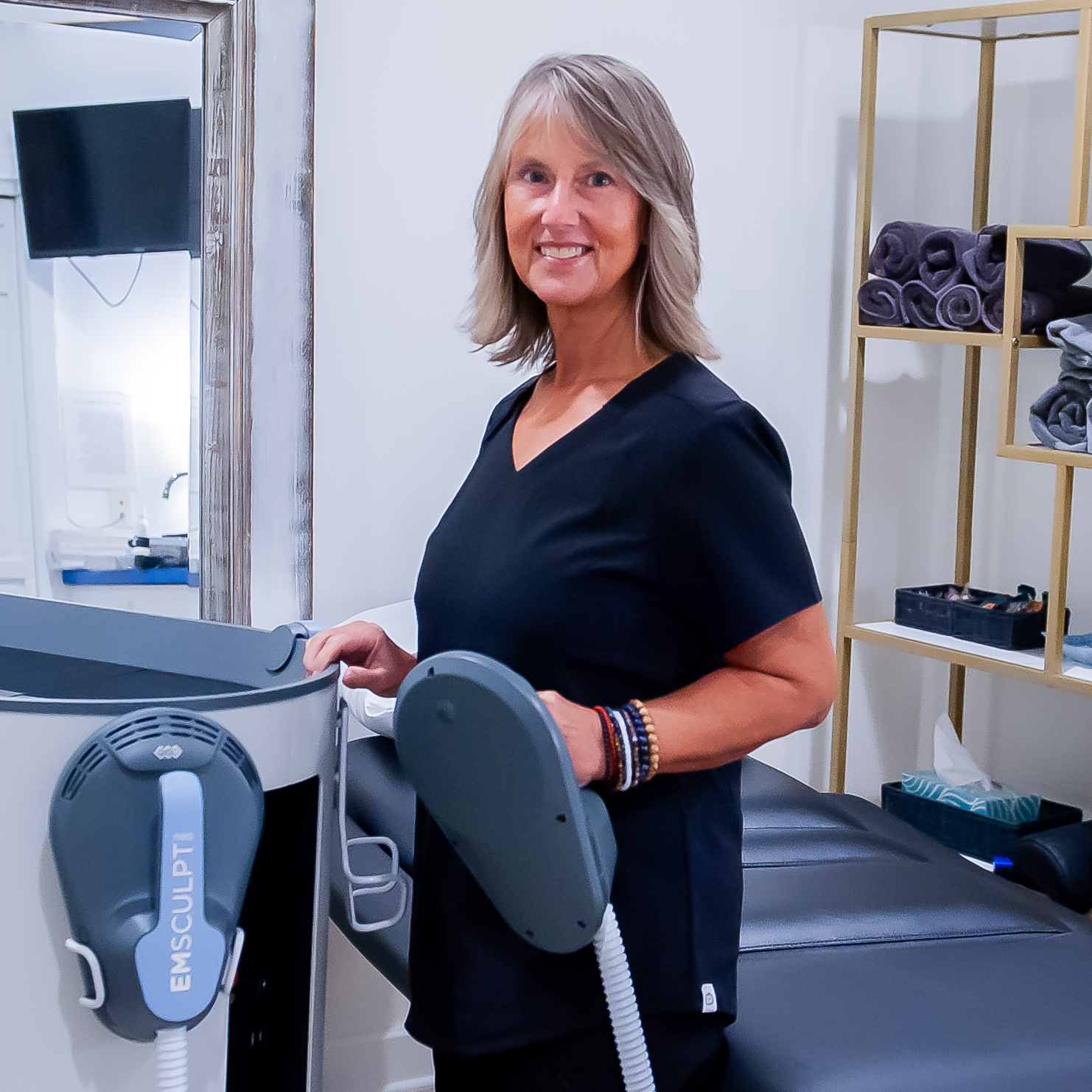 Nurse at Emsculpt body toning machine