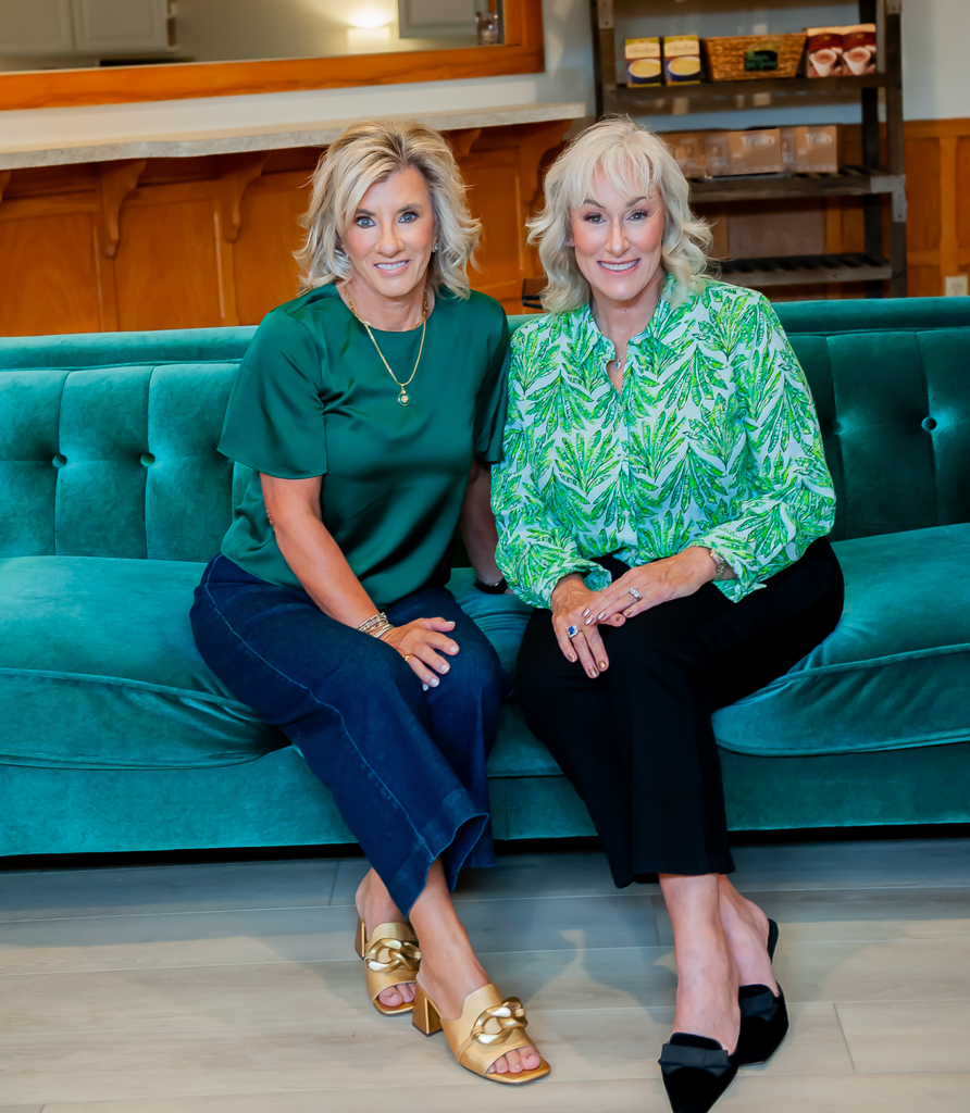 Two women sitting on couch
